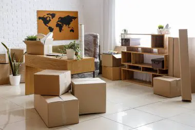 Professional office movers packing equipment for relocation