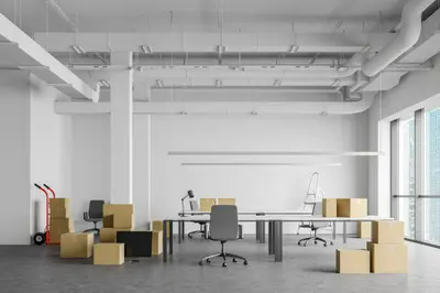  Employees packing boxes for office relocation